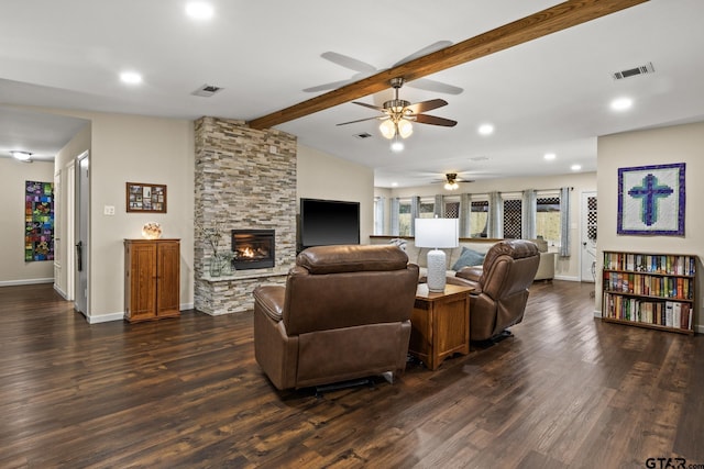 living room with lofted ceiling with beams, a stone fireplace, and dark hardwood / wood-style floors