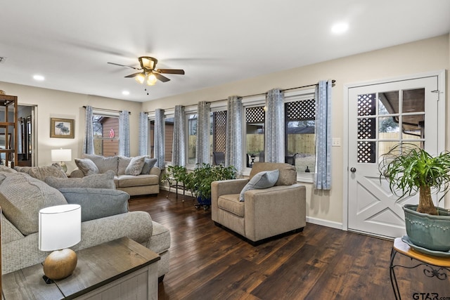 living room with ceiling fan and dark hardwood / wood-style floors