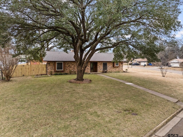 ranch-style house with a front lawn