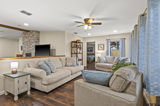 living room with dark wood-type flooring, ceiling fan, and lofted ceiling with beams