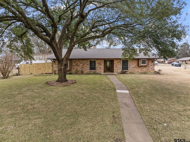 ranch-style home with a front lawn