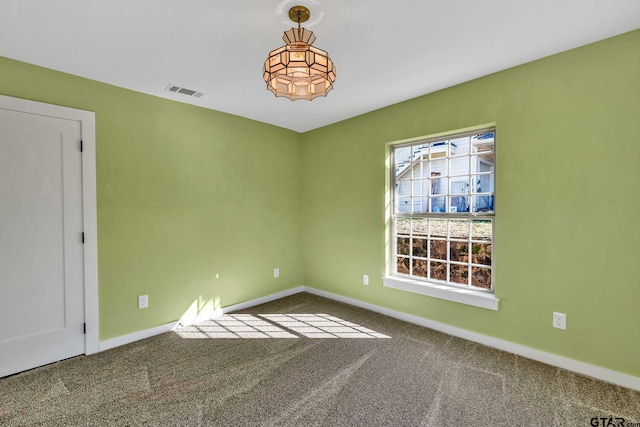 spare room featuring carpet flooring