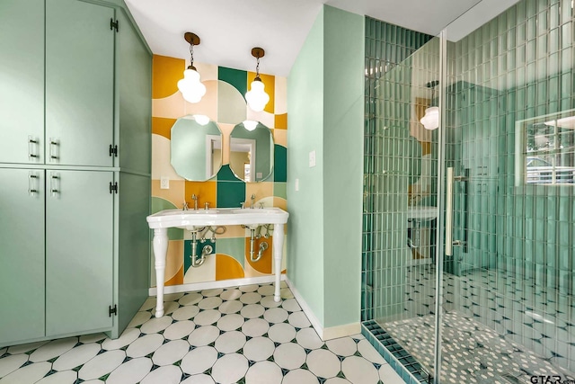 bathroom with vanity and a shower with door