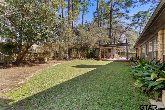 view of yard with fence private yard and a pergola