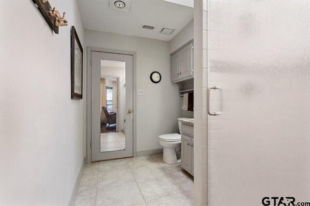 full bathroom featuring baseboards, vanity, toilet, and tile patterned floors