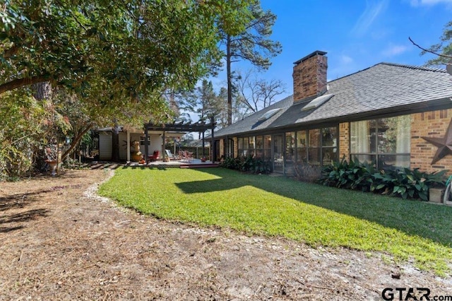 view of yard with a pergola