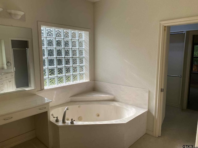 5304 Cedar Creek Dr, Kemp, TX 75143 - bathroom with a tub with jets, vanity, and a stall shower