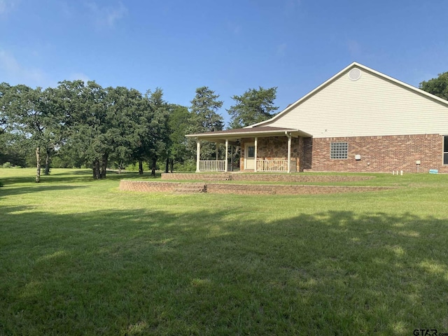 5304 Cedar Creek Dr, Kemp, TX 75143 - view of grassy yard with a porch