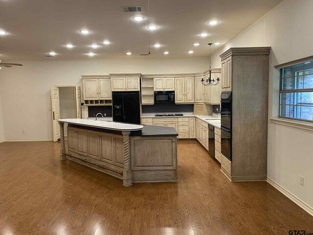 5304 Cedar Creek Dr, Kemp, TX 75143 - kitchen featuring black appliances, an island with sink, dark wood-type flooring, a ceiling fan, and decorative light fixtures