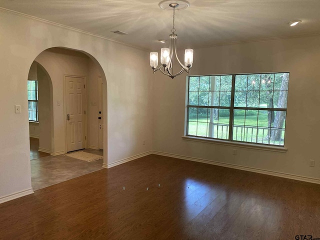 5304 Cedar Creek Dr, Kemp, TX 75143 - spare room featuring arched walkways, wood finished floors, a chandelier, plenty of natural light, and ornamental molding