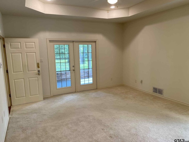 5304 Cedar Creek Dr, Kemp, TX 75143 - carpeted empty room featuring french doors and a tray ceiling