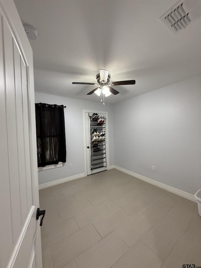 402 E Mims St, Tyler, TX 75702 - empty room with a ceiling fan and baseboards