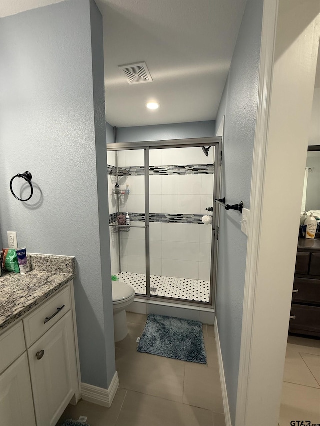 402 E Mims St, Tyler, TX 75702 - bathroom with tile patterned flooring, a stall shower, and vanity
