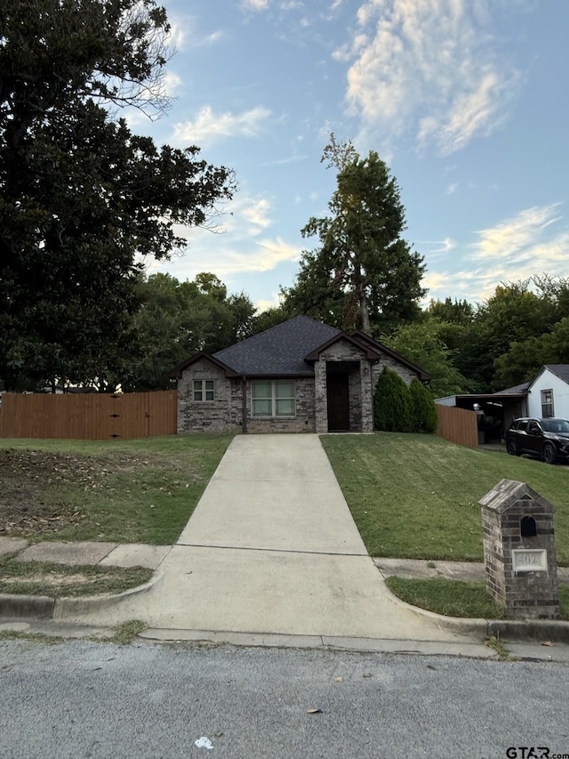 402 E Mims St, Tyler, TX 75702 - view of front of home with stone siding and roof with shingles