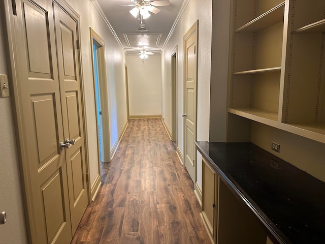 hall with dark hardwood / wood-style floors and ornamental molding