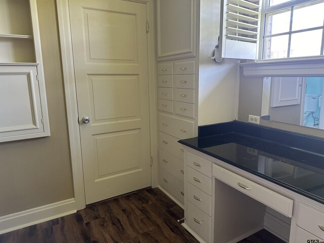 1248 Canada St, Jacksonville, TX 75766 - kitchen featuring dark wood-style flooring, white cabinetry, and dark countertops