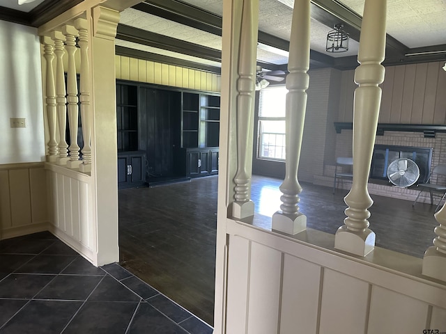 1248 Canada St, Jacksonville, TX 75766 - corridor featuring a decorative wall, dark tile patterned floors, and wainscoting