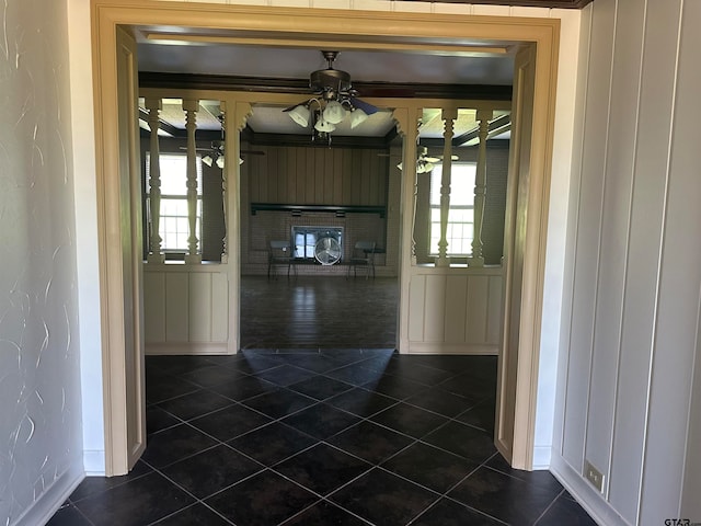 hallway with dark tile patterned flooring