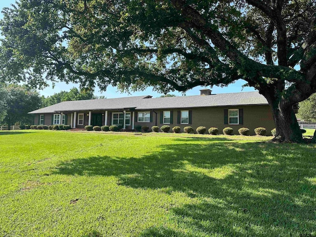 ranch-style house with a front lawn