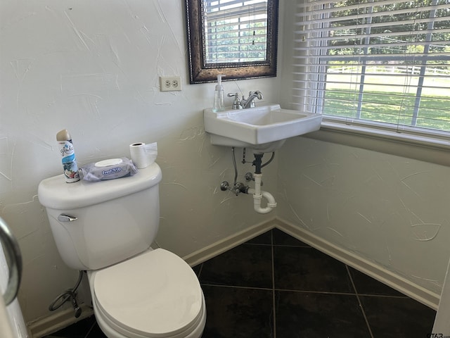 1248 Canada St, Jacksonville, TX 75766 - bathroom with toilet and tile patterned flooring