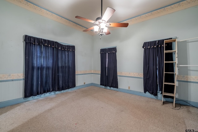 carpeted empty room with ceiling fan