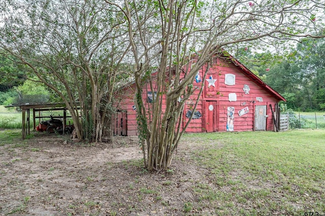 exterior space with a lawn and a carport