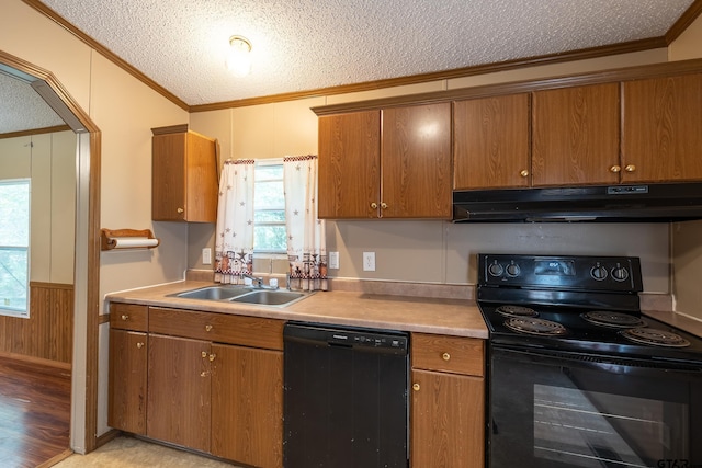 kitchen featuring black appliances, sink, crown molding, and a textured ceiling