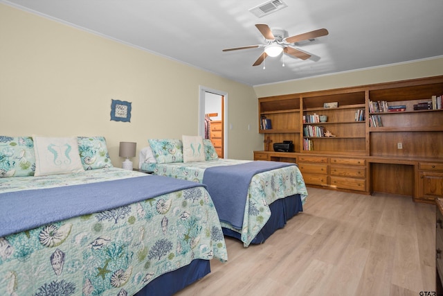 bedroom with ceiling fan, crown molding, and light hardwood / wood-style floors