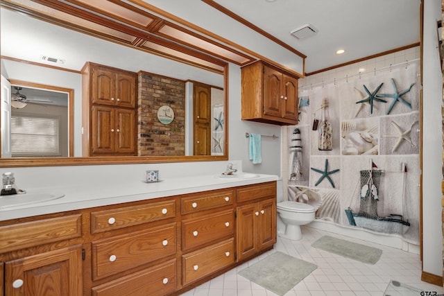 bathroom with a shower with shower curtain, vanity, toilet, and crown molding