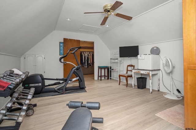 workout room featuring ceiling fan, light hardwood / wood-style floors, and lofted ceiling