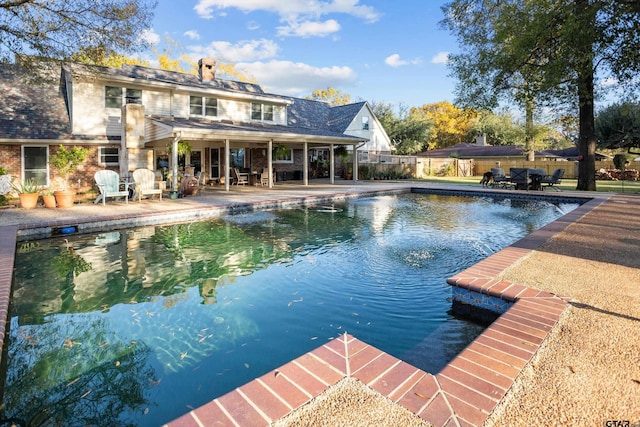 view of swimming pool featuring a patio area