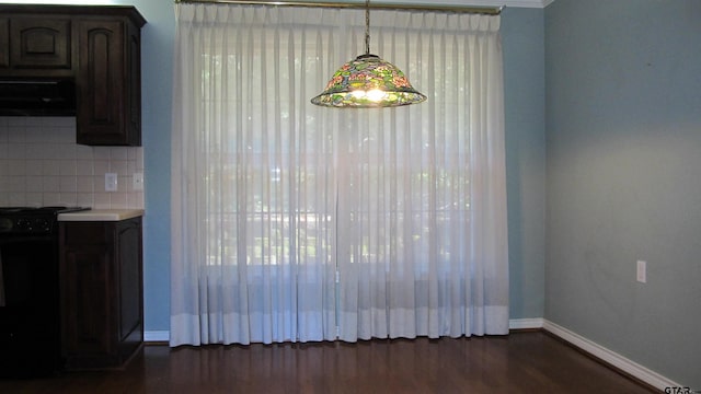 unfurnished dining area featuring dark hardwood / wood-style floors