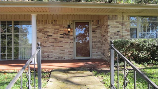 doorway to property with a porch