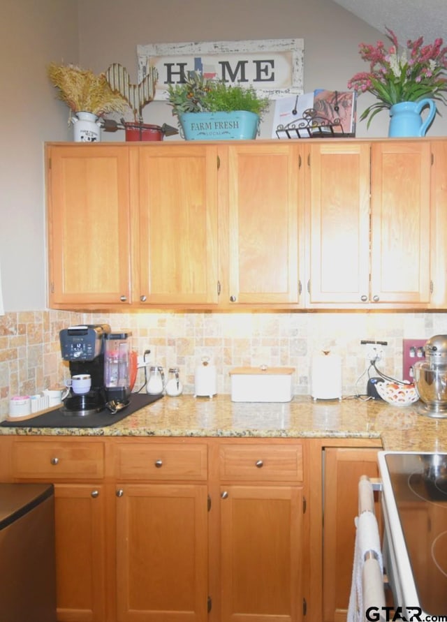 2333 Baretta Dr, Mesquite, TX 75181 - kitchen with tasteful backsplash, light stone countertops, and vaulted ceiling