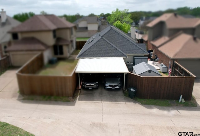2333 Baretta Dr, Mesquite, TX 75181 - view of front of property with driveway, roof with shingles, a chimney, and a residential view