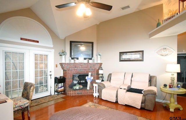 2333 Baretta Dr, Mesquite, TX 75181 - living area with wood finished floors, ceiling fan, vaulted ceiling, and a fireplace