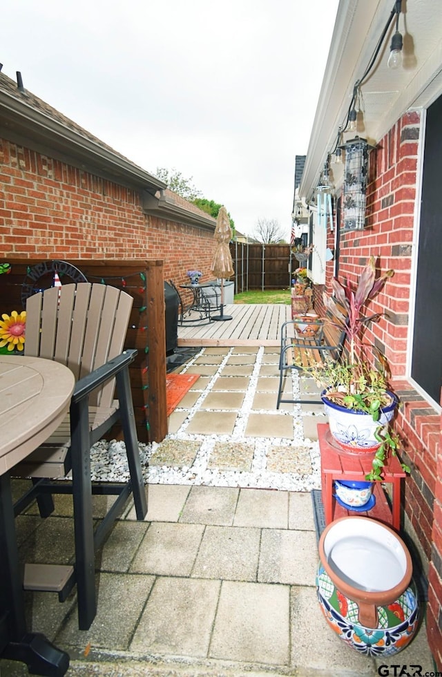 2333 Baretta Dr, Mesquite, TX 75181 - fenced backyard with a wooden deck, a patio, and outdoor dining area