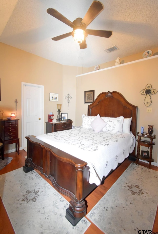 2333 Baretta Dr, Mesquite, TX 75181 - bedroom featuring wood finished floors and a ceiling fan