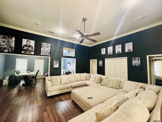 living room featuring ceiling fan, dark hardwood / wood-style flooring, and crown molding