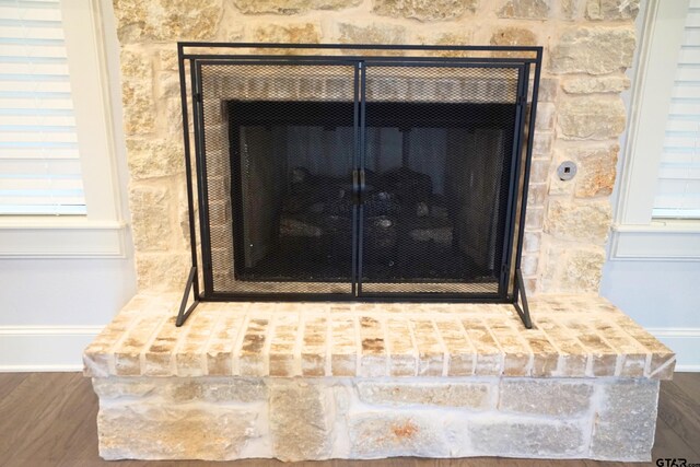 room details with a fireplace with raised hearth
