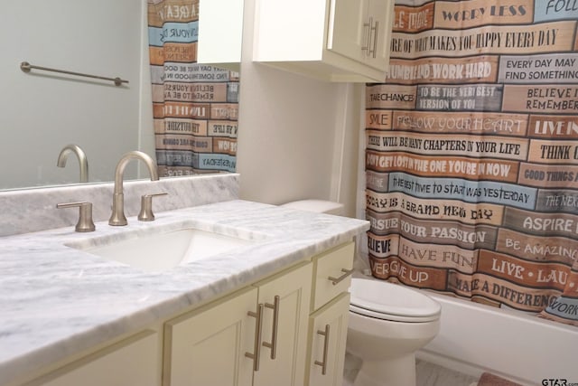 full bath with toilet and vanity