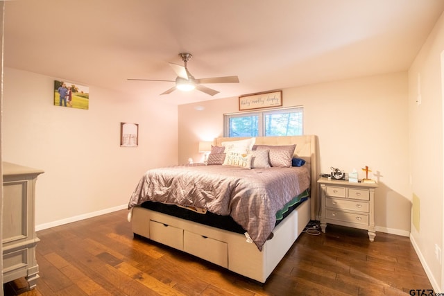 bedroom with a ceiling fan, baseboards, and dark wood-style flooring