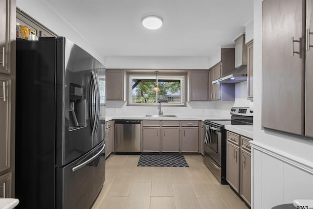 14553 Stone Creek Dr, Tyler, TX 75709 - kitchen featuring a sink, stainless steel appliances, light countertops, and wall chimney exhaust hood