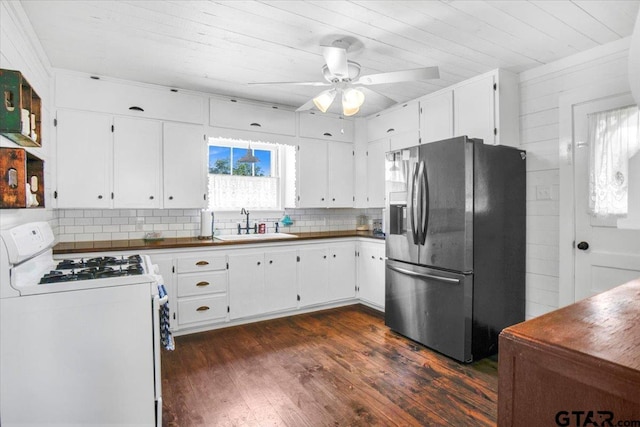 13926 State Highway 64e, Tyler, TX 75707 - kitchen featuring stainless steel refrigerator with ice dispenser, white gas range oven, wooden ceiling, dark wood-type flooring, and decorative backsplash