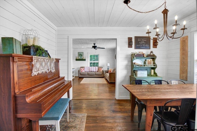 13926 State Highway 64e, Tyler, TX 75707 - dining space with wood walls, dark wood-type flooring, a chandelier, a ceiling fan, and wooden ceiling