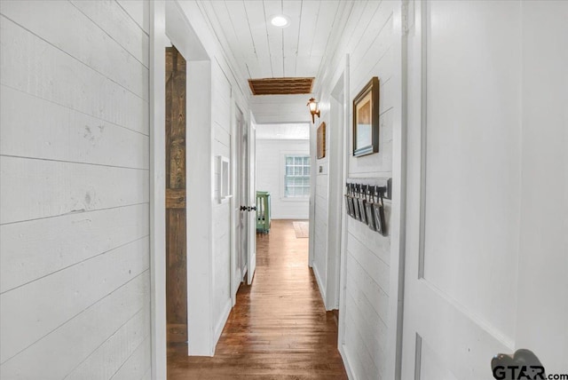 13926 State Highway 64e, Tyler, TX 75707 - hallway featuring wood finished floors and wood walls
