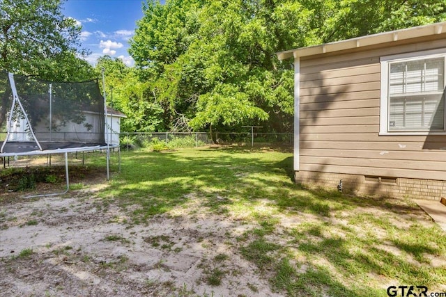 13926 State Highway 64e, Tyler, TX 75707 - fenced backyard featuring a trampoline