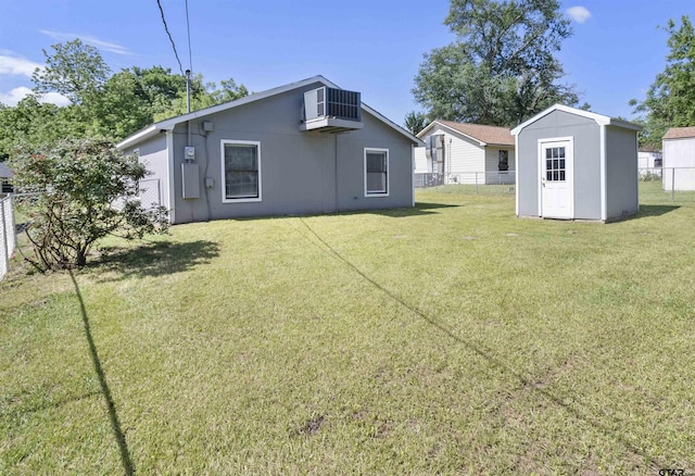 104 E Cedar St, Tyler, TX 75702 - rear view of property with a storage unit, central AC unit, an outdoor structure, and stucco siding
