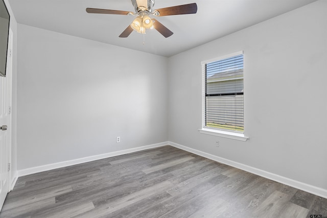 104 E Cedar St, Tyler, TX 75702 - spare room featuring wood finished floors, baseboards, and a ceiling fan