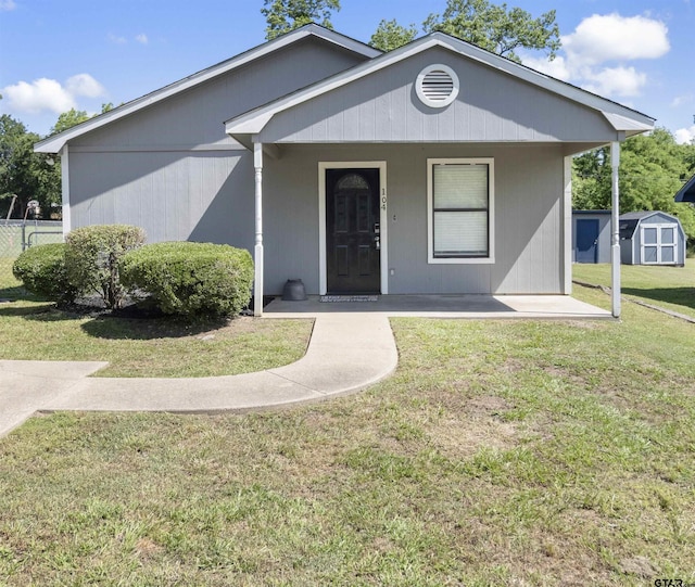 104 E Cedar St, Tyler, TX 75702 - view of front of home with a shed, a porch, and an outbuilding